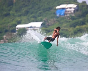 LMBK Surf House guest surfing Don Don Lombok
