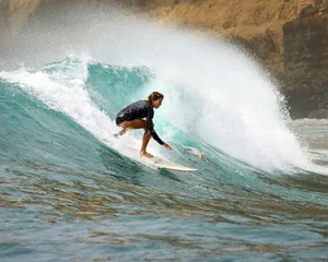 LMBK Surf House guest surfing Outside Gerupuk Kuta Lombok